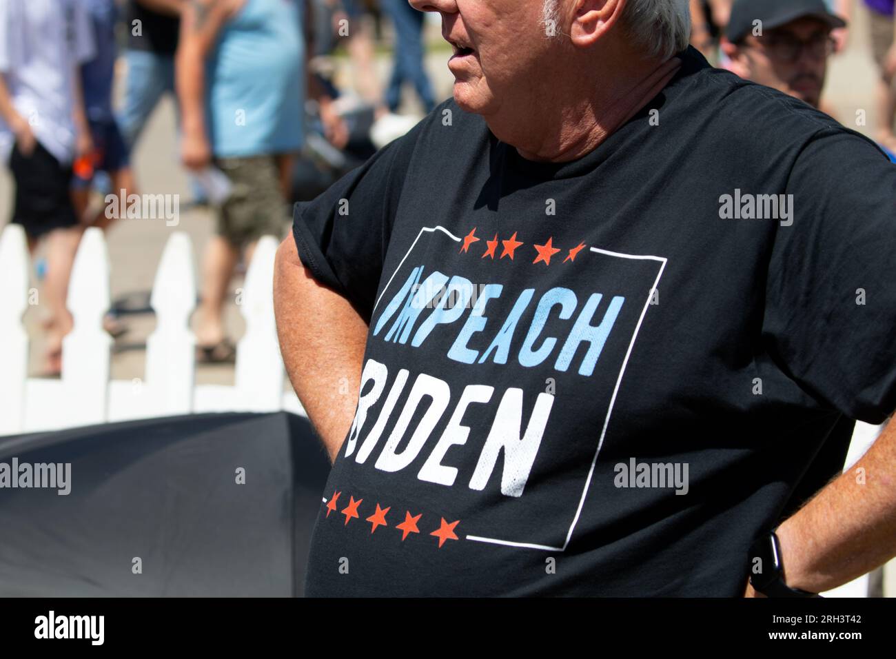 Des Moines, Iowa, USA - August 12, 2023: A man wearing an Impeach Biden t-shirt at the Iowa state fair in Des Moines, Iowa, United States. Stock Photo