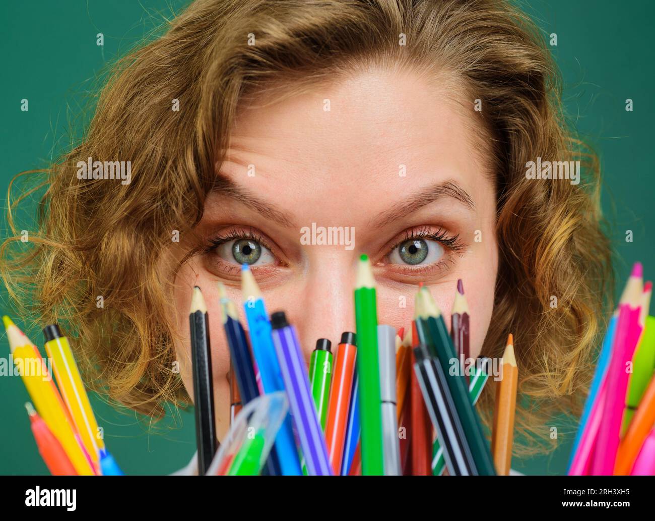 Close up portrait female teacher with pencils. School supplies. Back to school. College student girl in classroom. Knowledge day. Teacher preparing Stock Photo