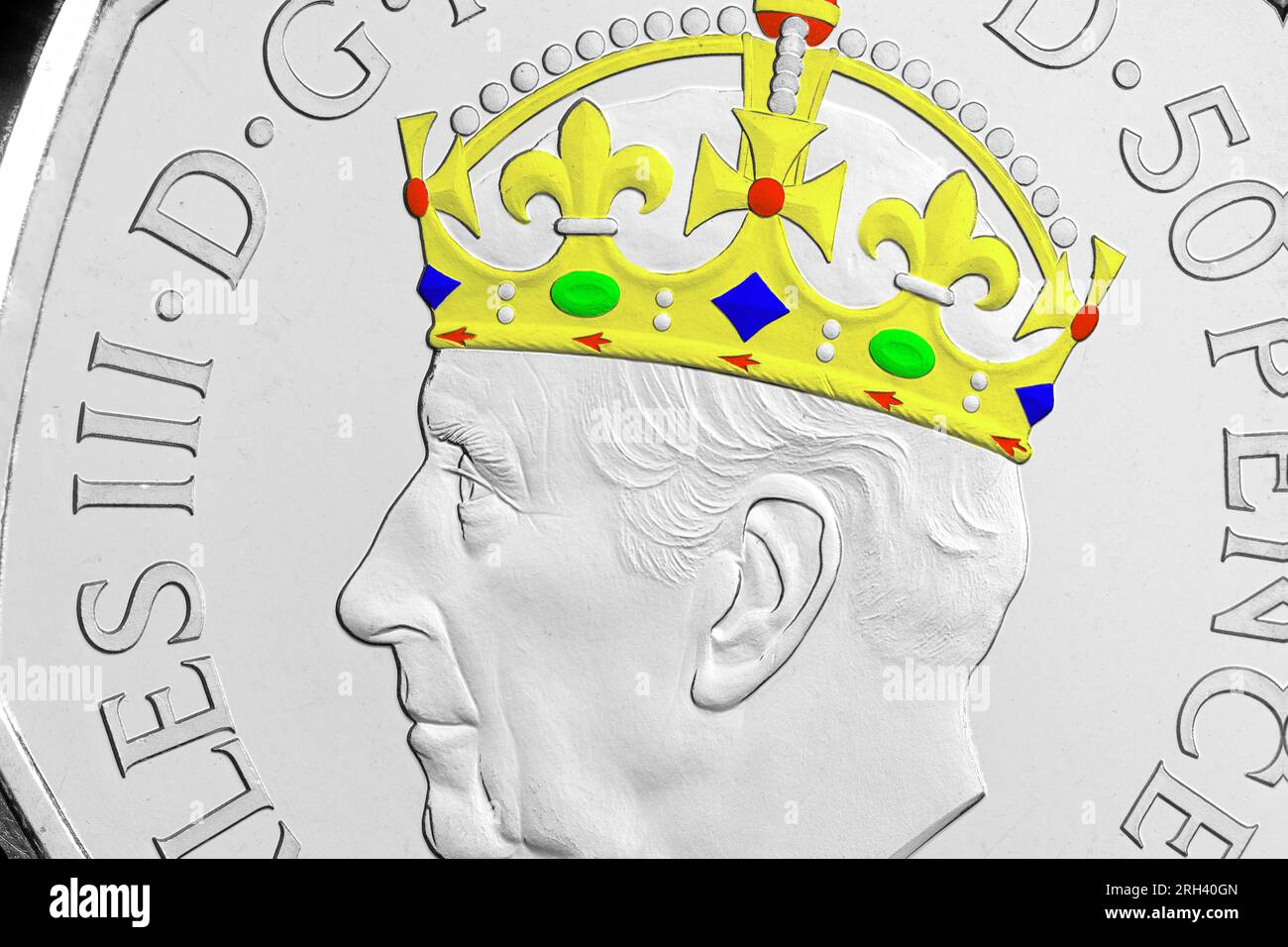 A close up of King Charles III coni portrait on a 50p with added colouring  Stock Photo - Alamy