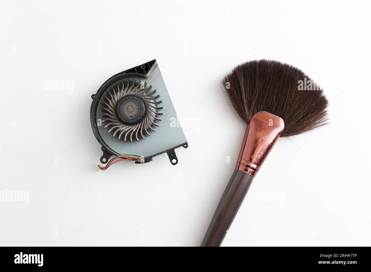 https://c8.alamy.com/comp/2RH41TP/cleaning-brush-and-dusty-laptop-cooling-fan-on-white-background-air-vent-fan-for-heatsink-cooling-system-for-cpu-fixing-overheating-professional-te-2RH41TP.jpg