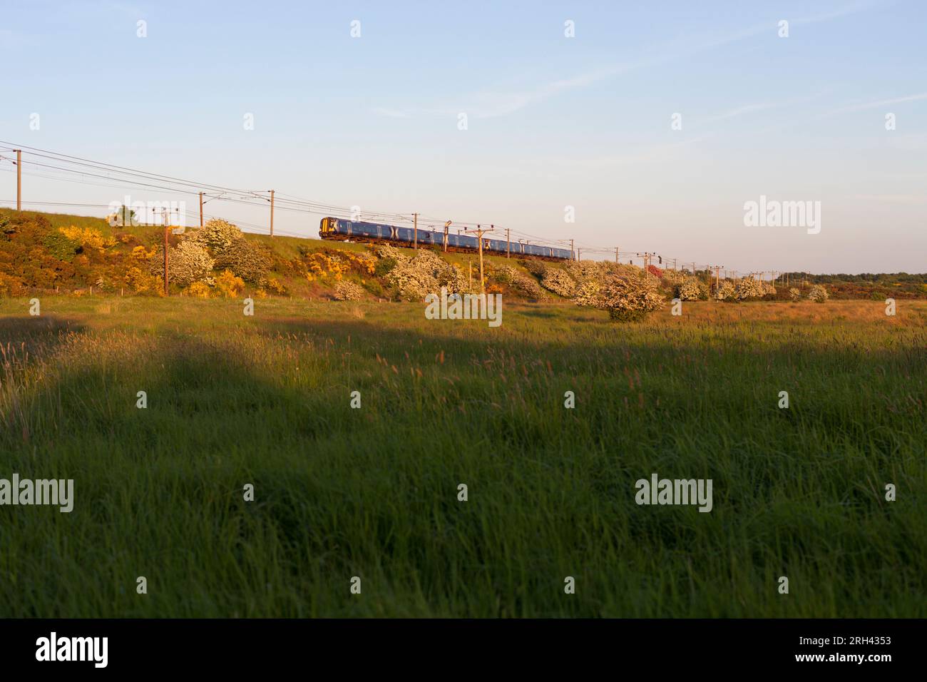 2 Scotrain Siemmens class 380 electric trains passing Kilwinning on the