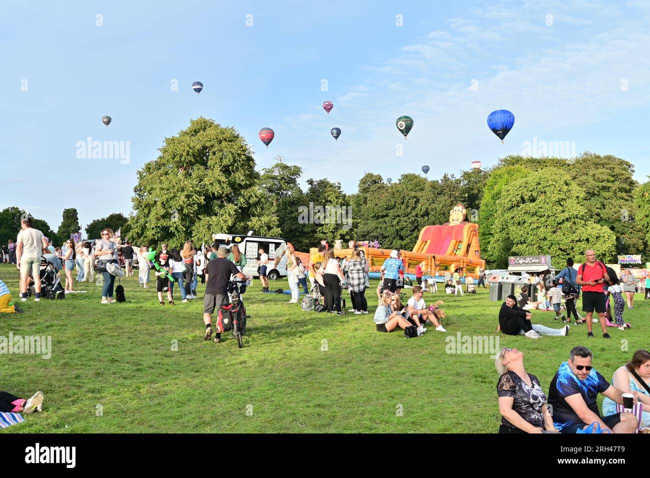 11th August 2023. Bristol Balloon Festival. Huge crowds turned out to see a mass evening assent of Hot air Balloons at Ashton Court Estate. Picture Cr Stock Photo