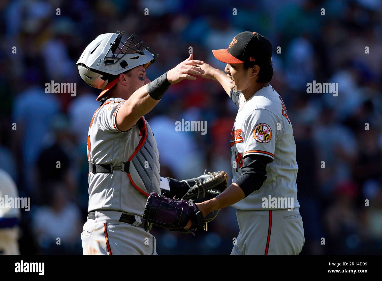 Shintaro Fujinami and James McCann of the Baltimore Orioles return