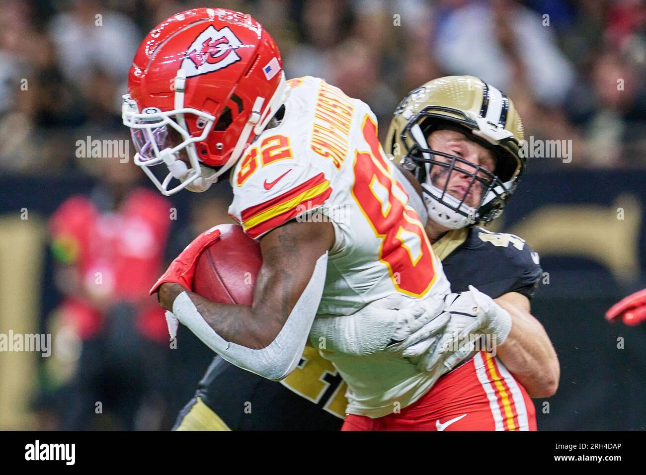 New Orleans, Louisiana, USA. 13th Aug, 2023. (front to back) Kansas City  Chiefs linebacker Nick Bolton is tackled by New Orleans Saints linebacker  Ty Summers in an NFL preseason game in New