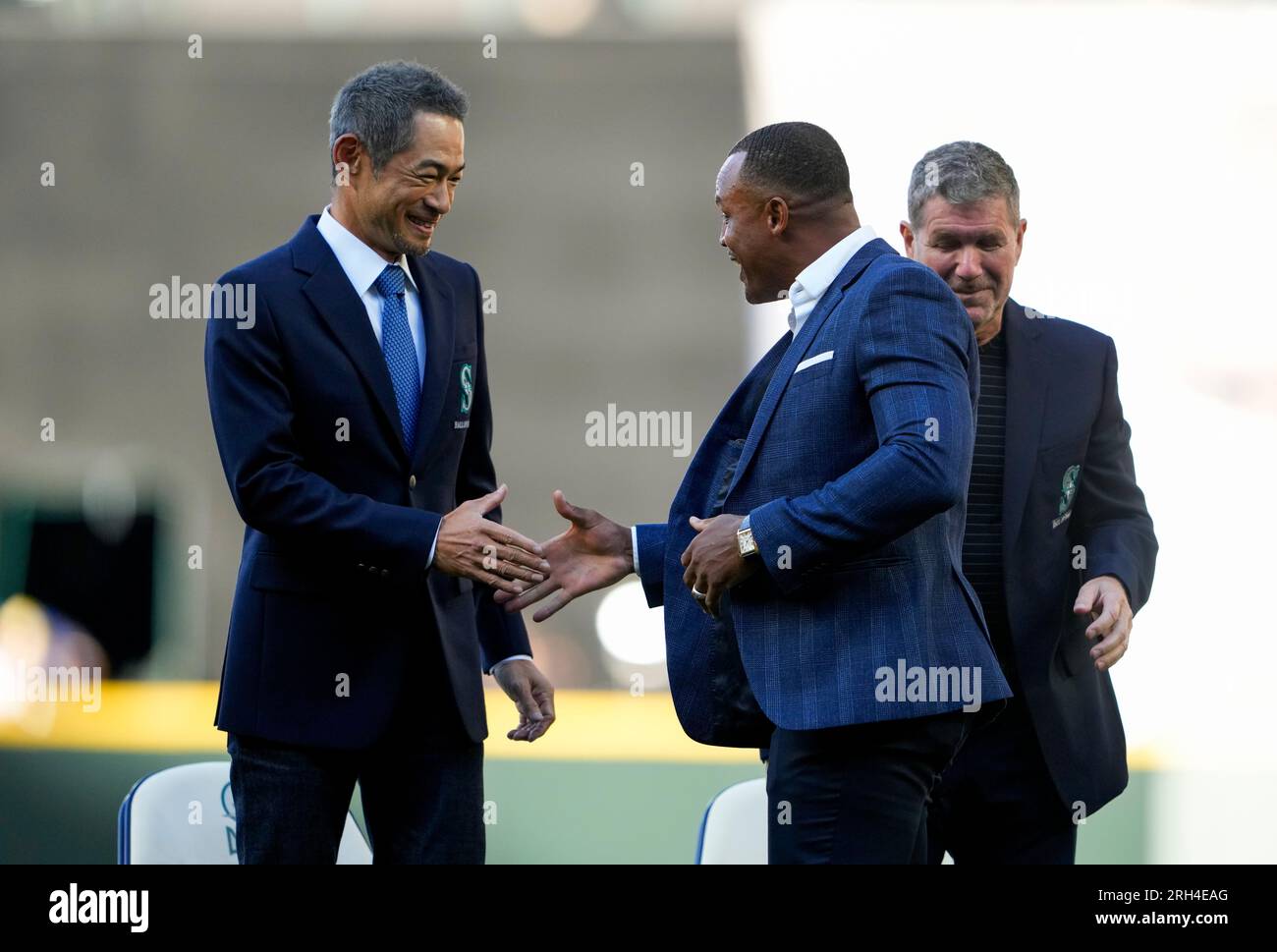 Former baseball player Adrian Beltre, left, greets former teammate Félix  Hernández after he was inducted into the Mariners Hall of Fame during a  ceremony before a baseball game between the Mariners and