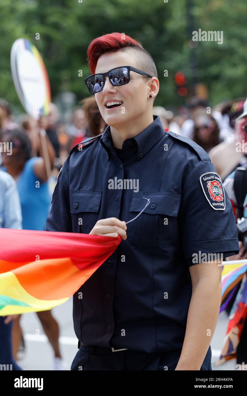 Montreal Firemen participate in the  Montreal Pride Parade Stock Photo