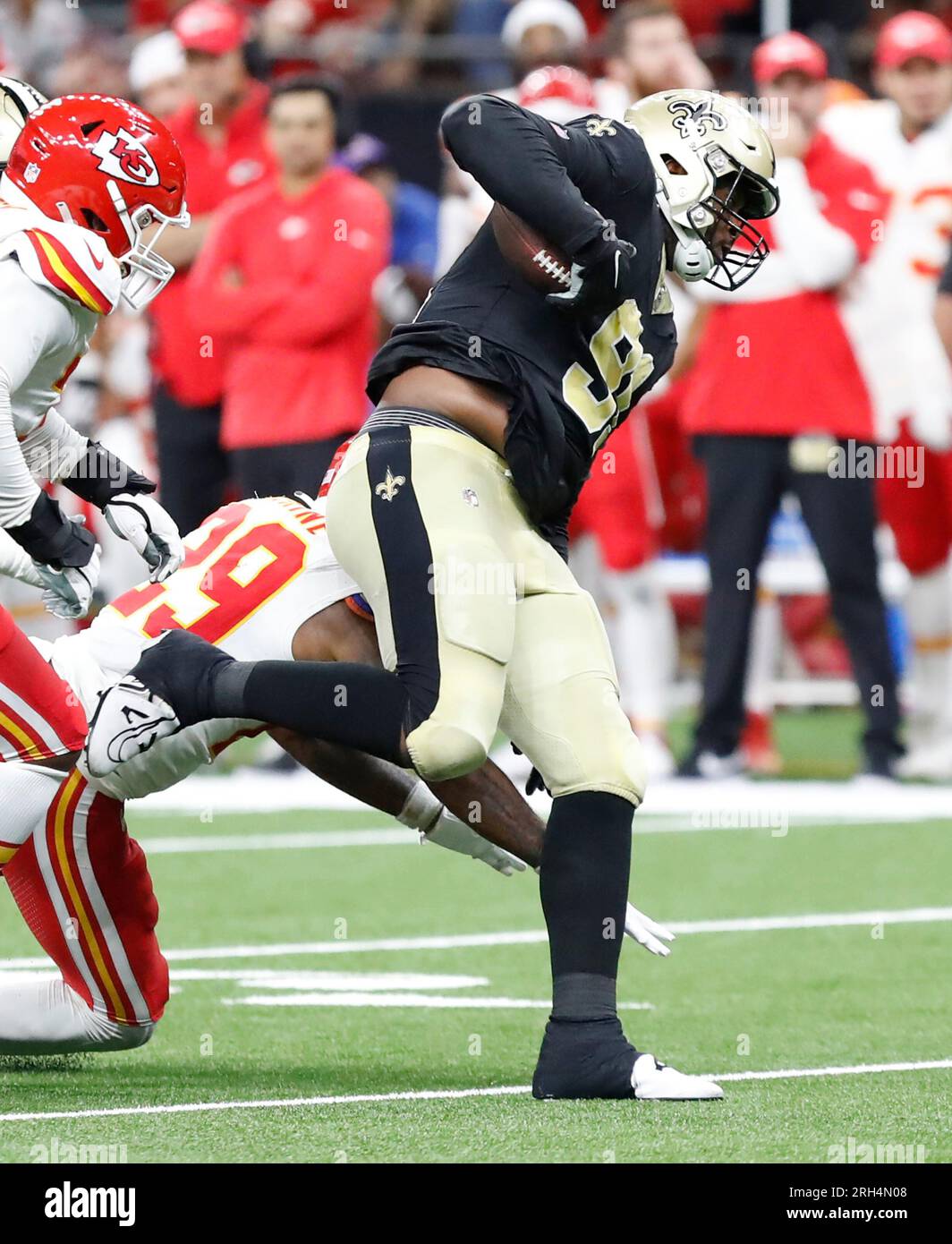 New Orleans, USA. 13th Aug, 2023. Kanas City Chiefs linebacker Drue  Tranquill (23) and defensive back Chammari Conner (29) both tackle New  Orleans Saints running back Jamaal Williams (30) during a National