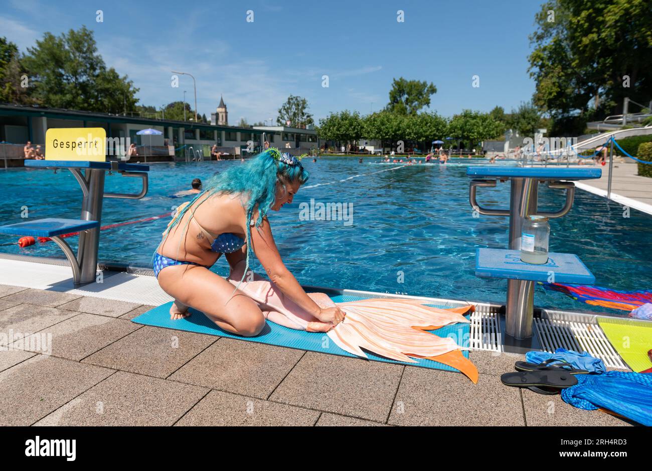 Balingen, Germany. 11th Aug, 2023. Andrea Wolfert puts on a tail fin and  dresses up as
