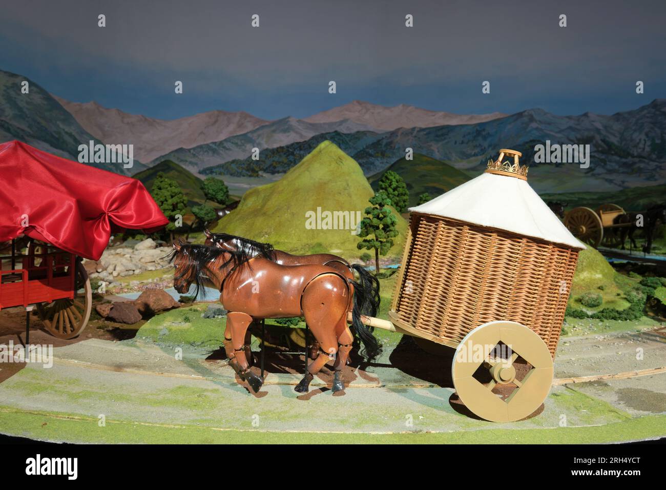 A model of horses pulling a basket weave yurt, part of a nomadic ...