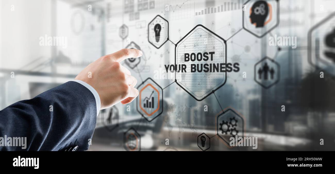 Boost Your Business 2023. Businessman touching finger virtual screen. Stock Photo