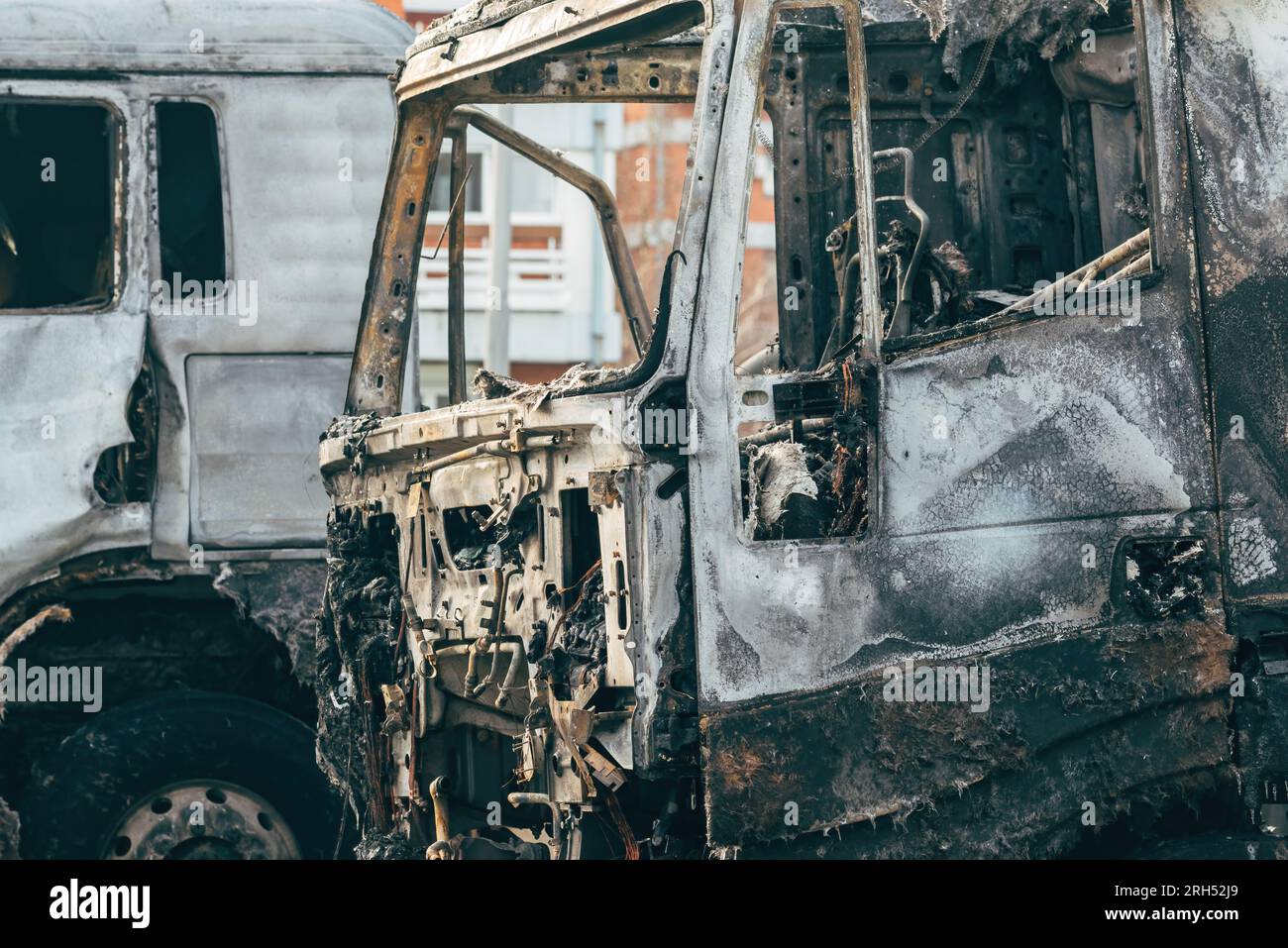 Semi truck engulfed by fire flames after traffic accident is burned and damaged, selective focus Stock Photo