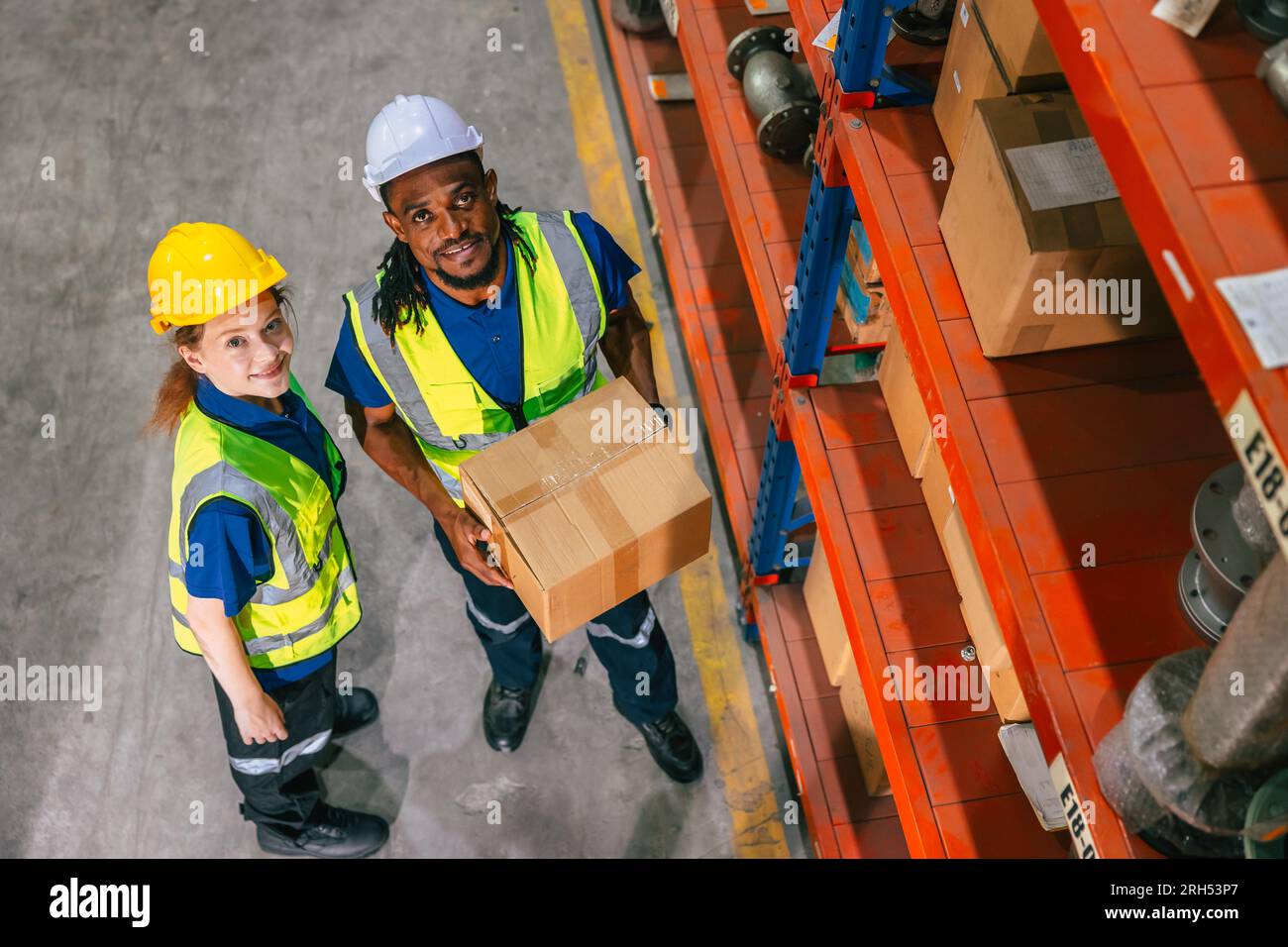 cargo warehouse worker happy working in warehouse shipping logistics industry delivery products supply Stock Photo