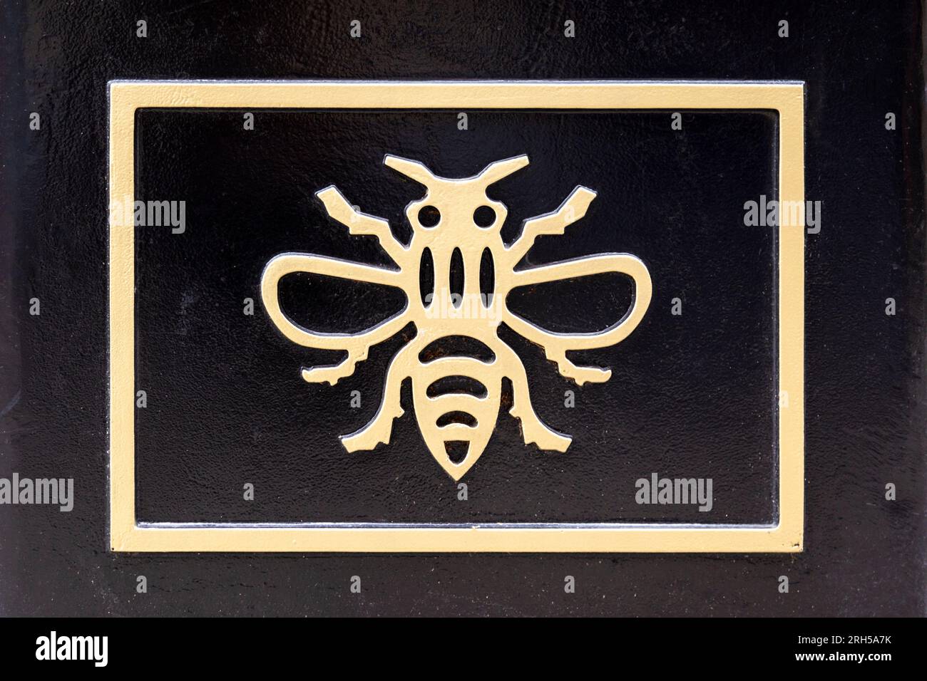 A bee design by Hargreaves Foundry embossed on a planter in Manchester, England Stock Photo