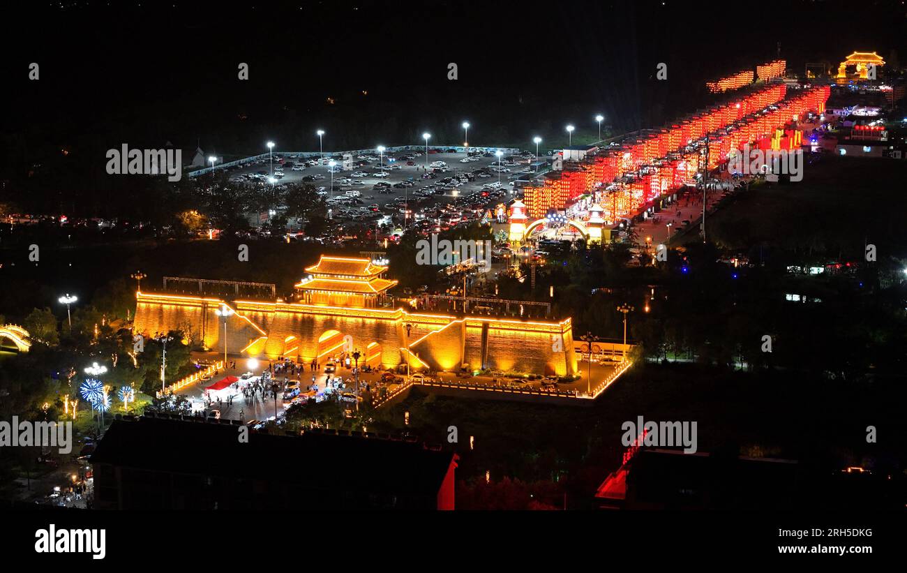 BINZHOU, CHINA - AUGUST 13, 2023 - Tourists enjoy the night scenery at Sunwu City in Huimin county, Binzhou city, East China's Shandong province, Aug Stock Photo