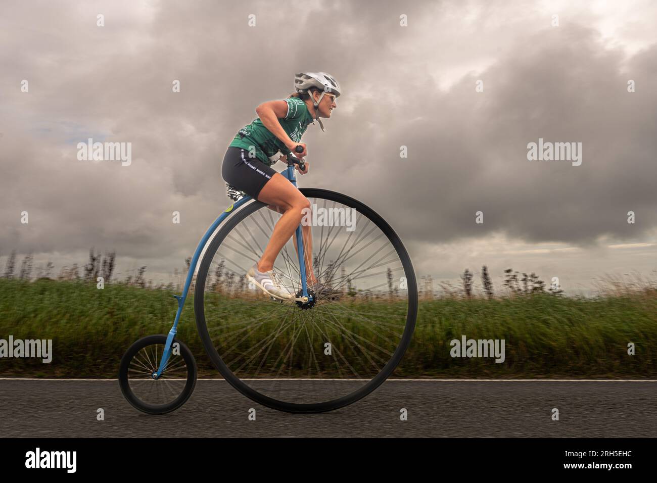 Competitors take part in a penny farthing time trial hill hi-res stock ...