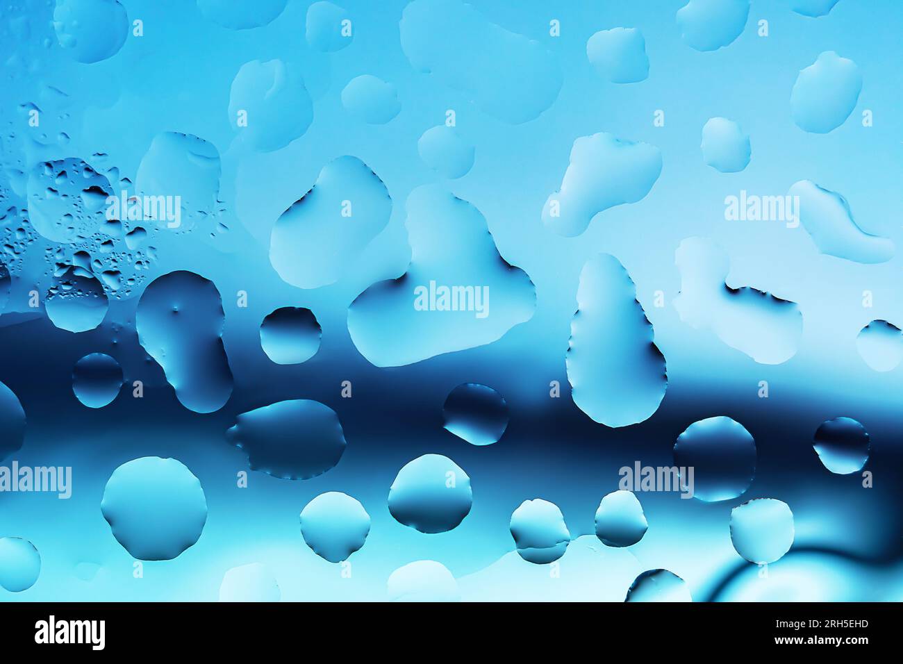 Water drops on a glass surface close up Stock Photo