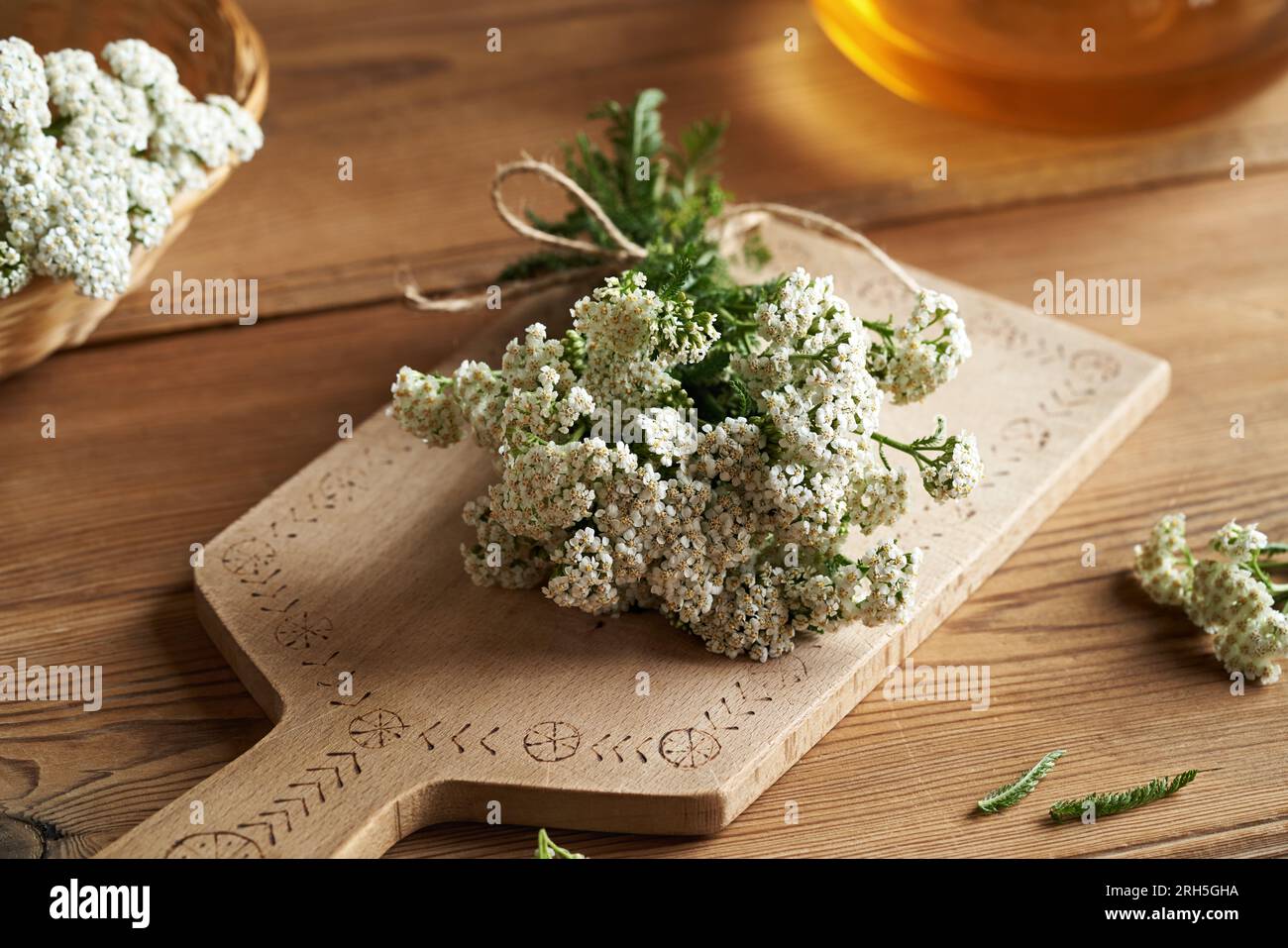 Fresh yarrow flowers on a table, close up Stock Photo