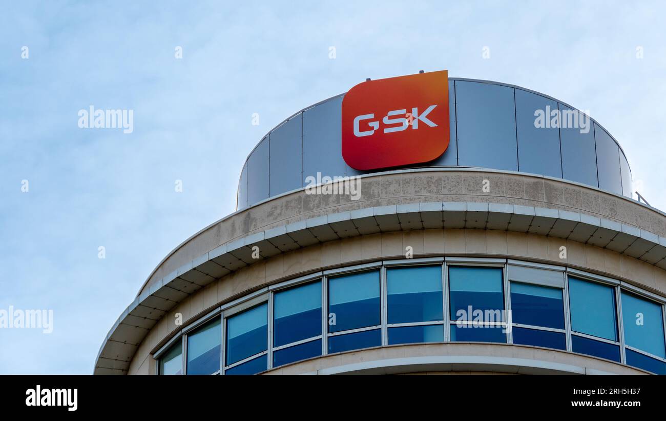 Sign and logo on the building housing the French headquarters of GSK, formerly GlaxoSmithKline, a British multinational pharmaceutical company Stock Photo