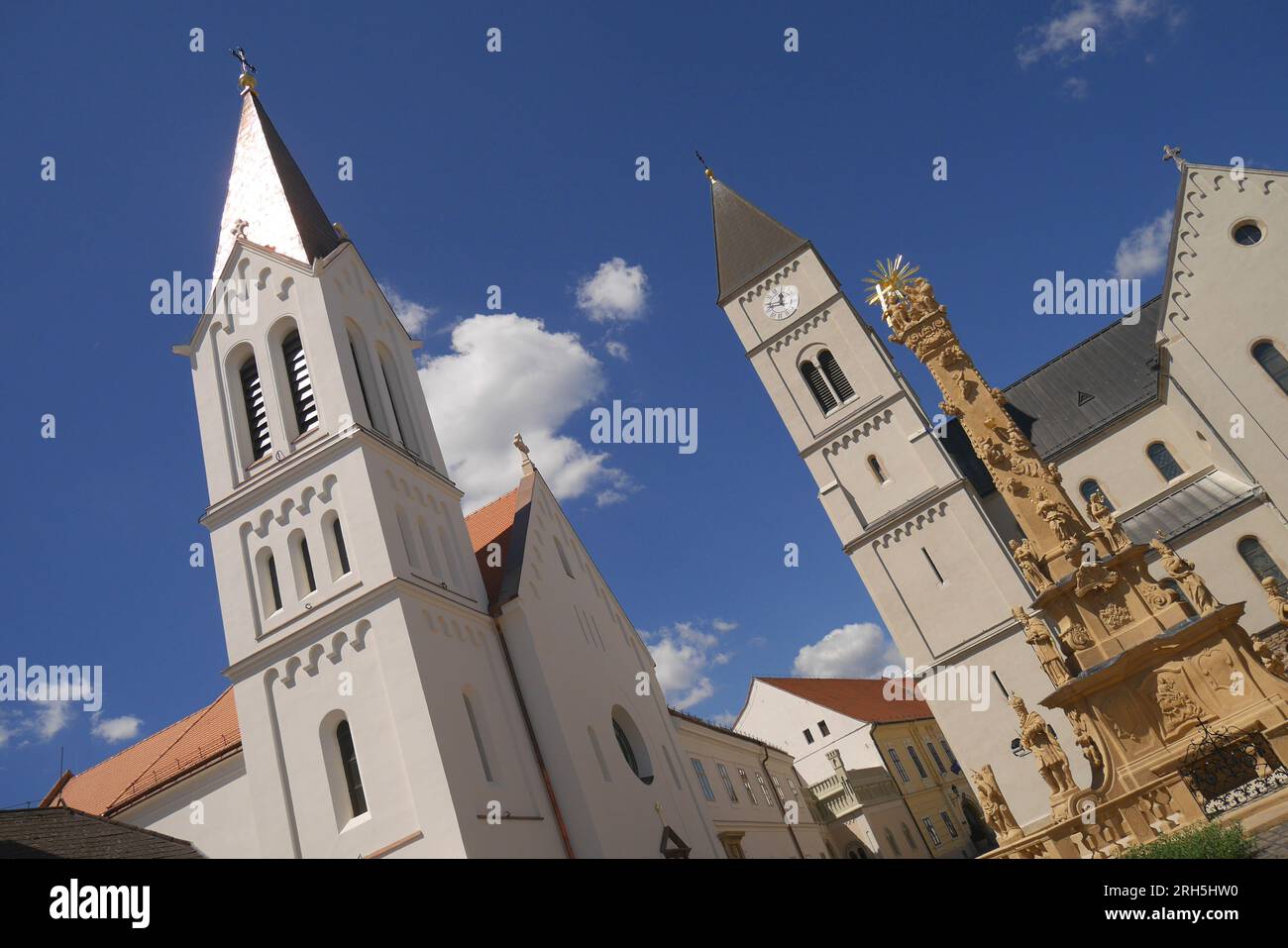 The Hungarian baroque Holy Trinity Column, the Franciscan Church, and the Catholic St Michael’s Church, Holy Trinity Square, Veszprem, Hungary Stock Photo