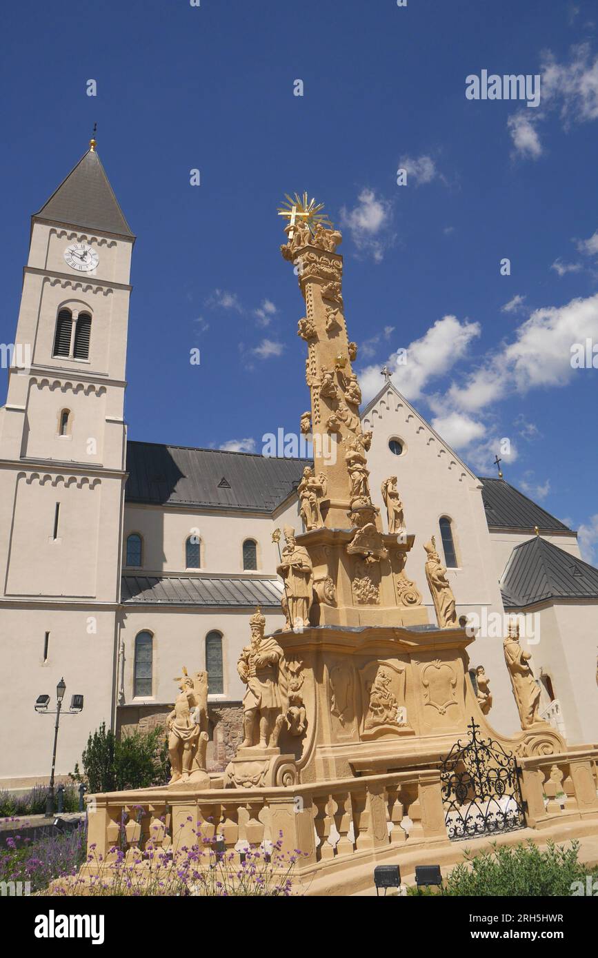 The Hungarian baroque Holy Trinity Column, Holy Trinity Square, with St Michael’s Church behind, Veszprem, Hungary Stock Photo