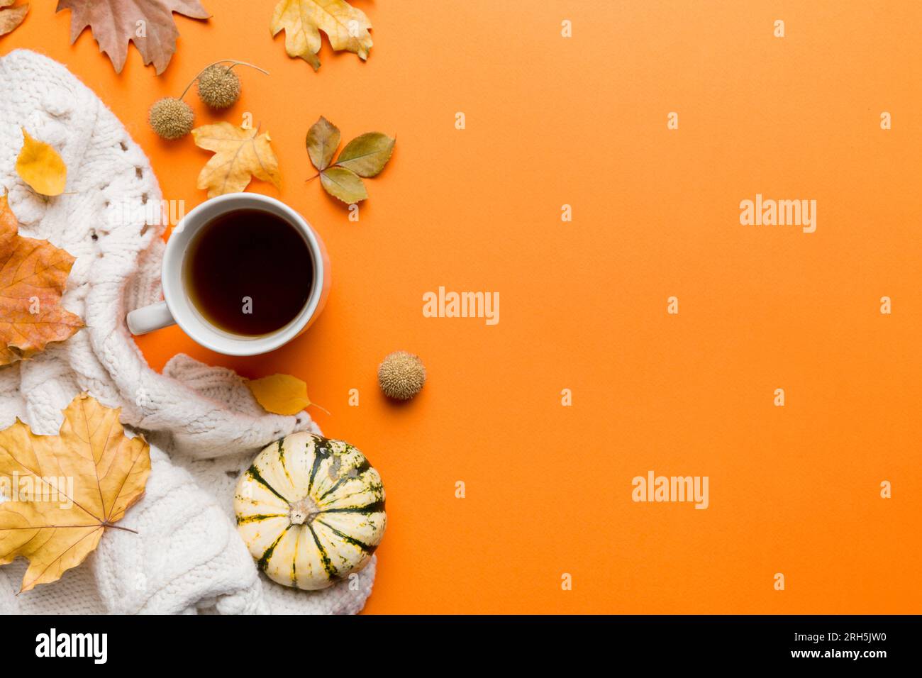 Flat lay composition with colorful Autumn cup of coffee and leaves on a ...