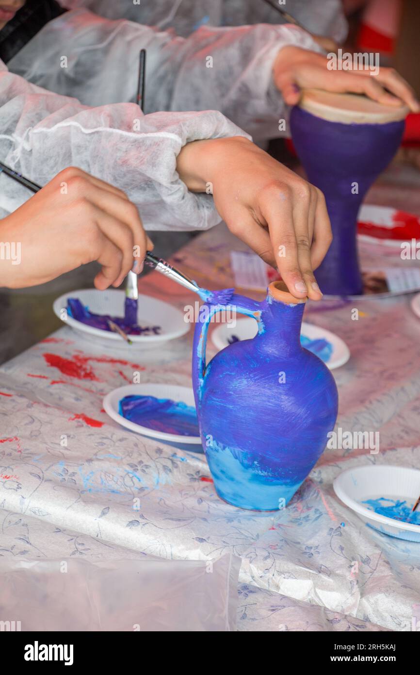 Kids painting pottery and handcrafts Stock Photo Alamy