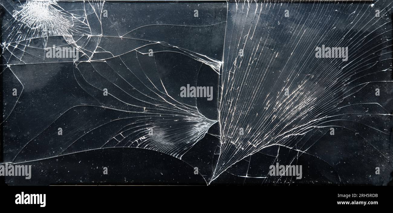 Broken glass texture on black background Stock Photo
