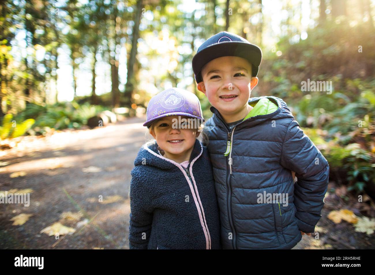 Portrait of brother and sister outdoors, on an adventure Stock Photo ...