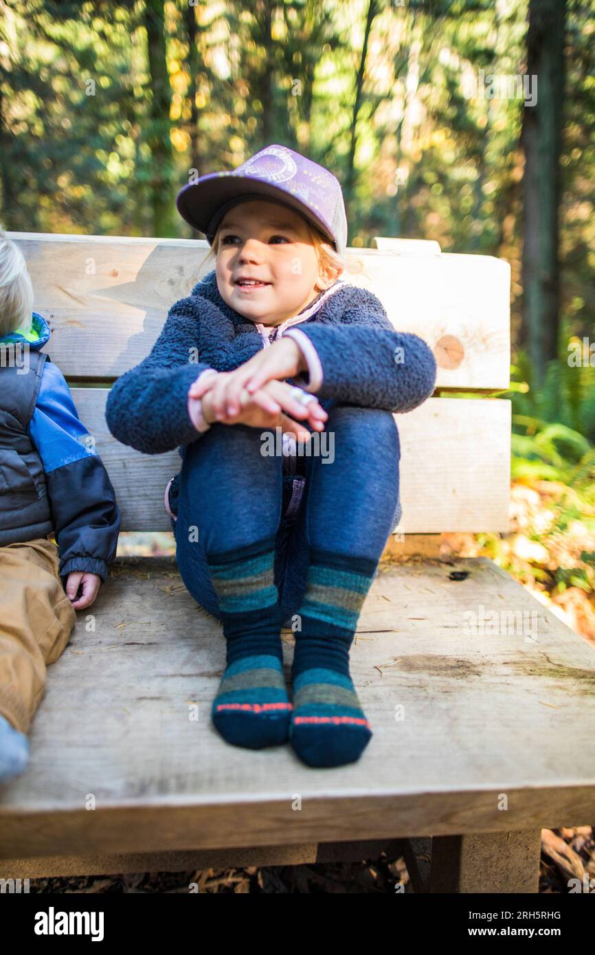 Boy girl wearing jeans sitting hi res stock photography and images