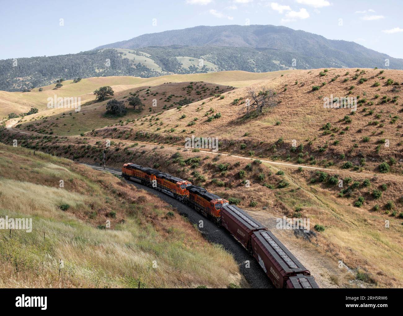 Overhead view of freight train going through landscape Stock Photo