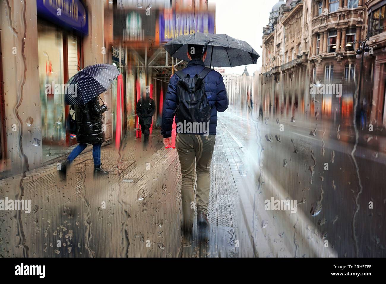 Pedestrian with umbrella hi-res stock photography and images - Alamy