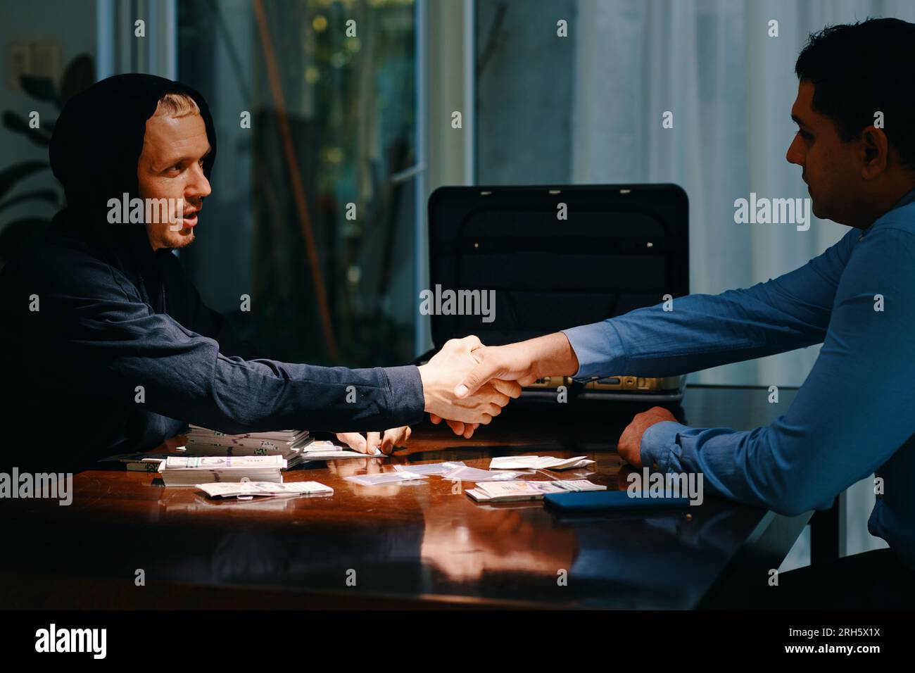 Cop who going undercover to catch drug dealers shaking hand of police