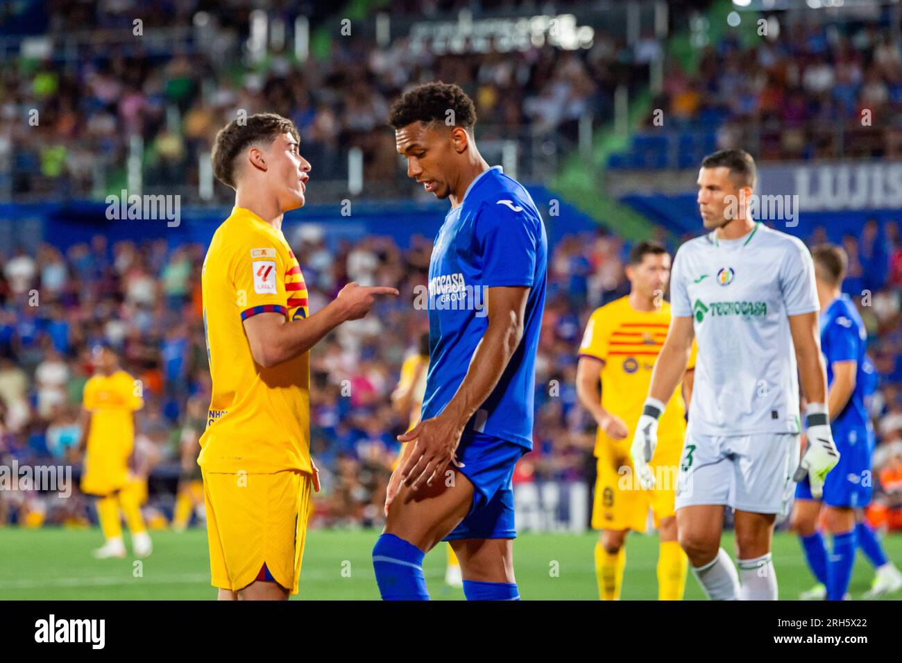 Getafe, Madrid, Spain. 13th Aug, 2023. Gaston Alvarez (Getafe) and Gavi (Barcelona) after the controversial play with the alleged penalty not whistled by the referee at the end of the LaLiga EA Sports football match between Getafe and Barcelona played at Coliseum Alfonso Perez Stadium on August 13, 2023 in Getafe, Spain (Credit Image: © Alberto Gardin/ZUMA Press Wire) EDITORIAL USAGE ONLY! Not for Commercial USAGE! Stock Photo