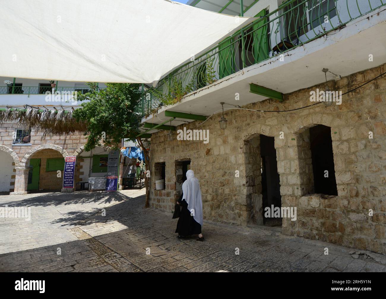 A Druz woman walking in the village of Peki'in in the Upper Galilee region in northern Israel. Stock Photo