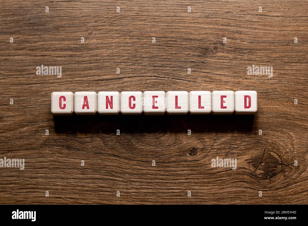Cancelled word concept on building blocks, text, letters Stock Photo