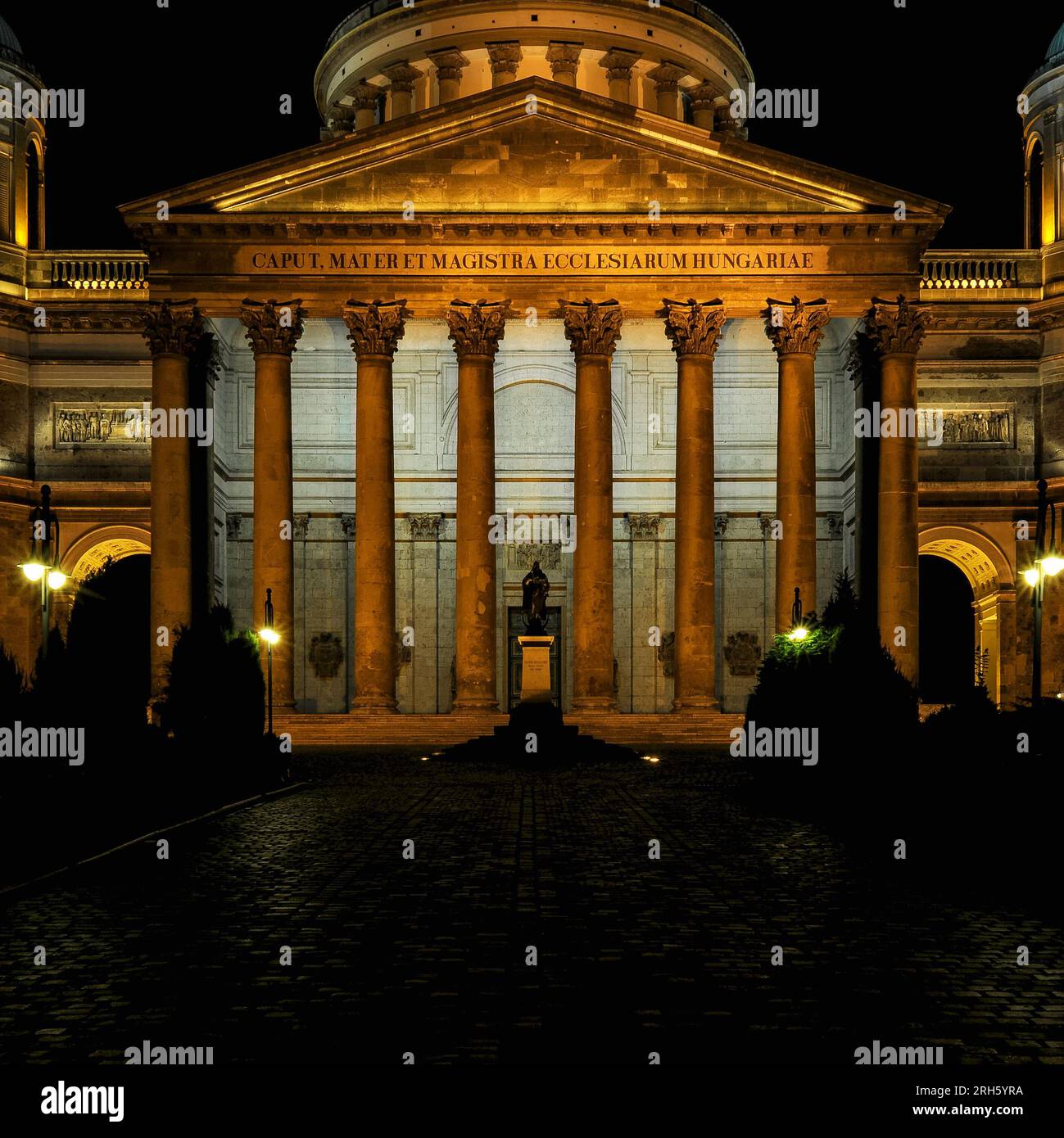 East front of Esztergom Basilica in Hungary.  The basilica, completed in 1869, was built in neoclassical style and is unusual because its main facade faces east.  The Latin inscription on the portico (“Caput Mater et Magistra Ecclesiarum Hungariae”) translates as “Head, Mother and Teacher of the Hungarian Churches”. Stock Photo