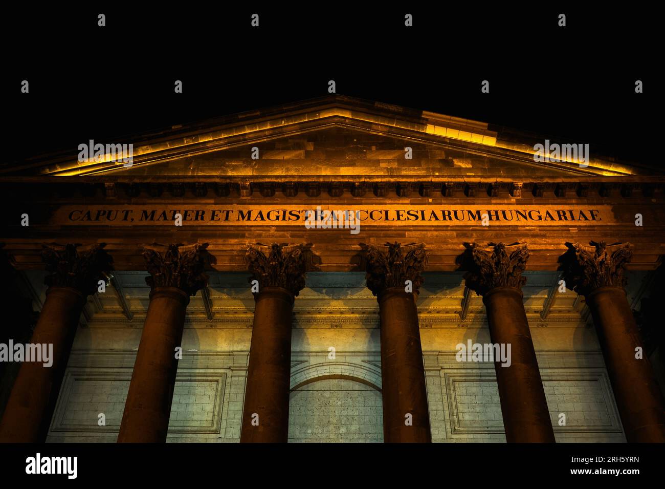 Latin inscription, tympanum, capitals and columns of portico on east