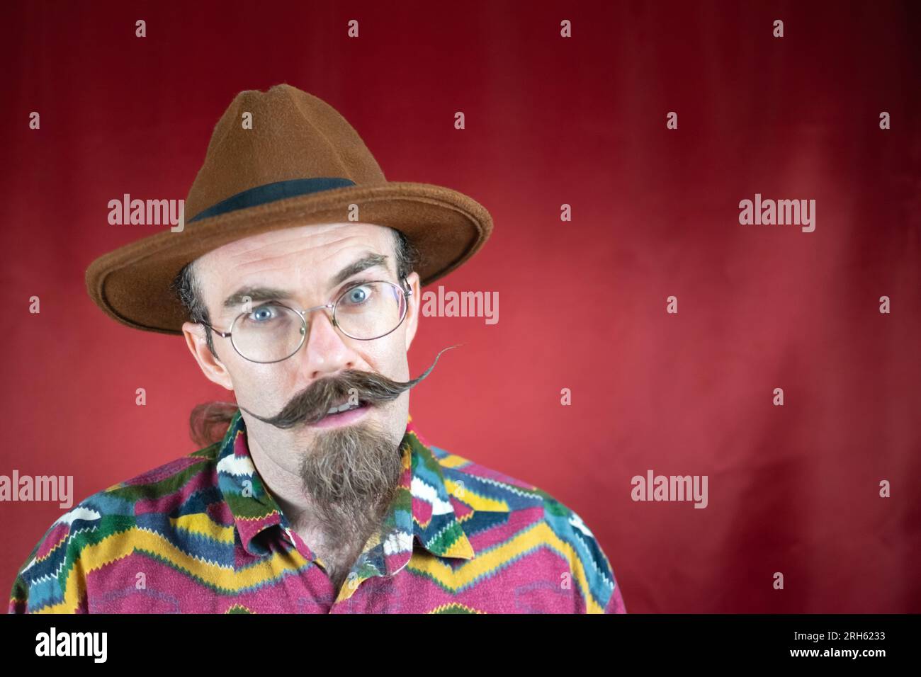 Vintage Hipster man with mustache, glasses and expression of not understanding Stock Photo