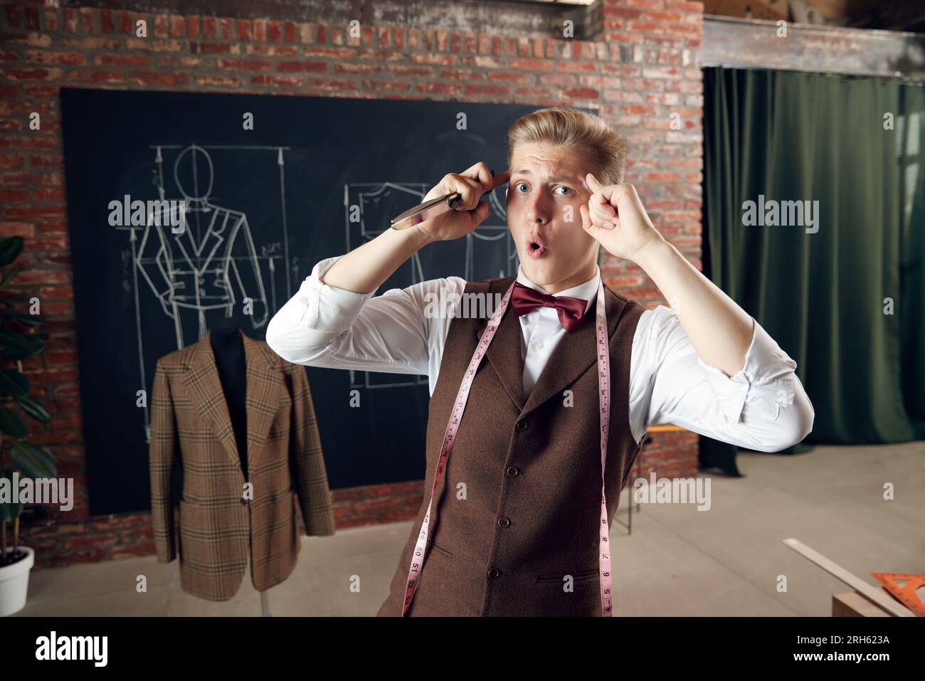 Young man, fashion designer with emotional face, generating new 