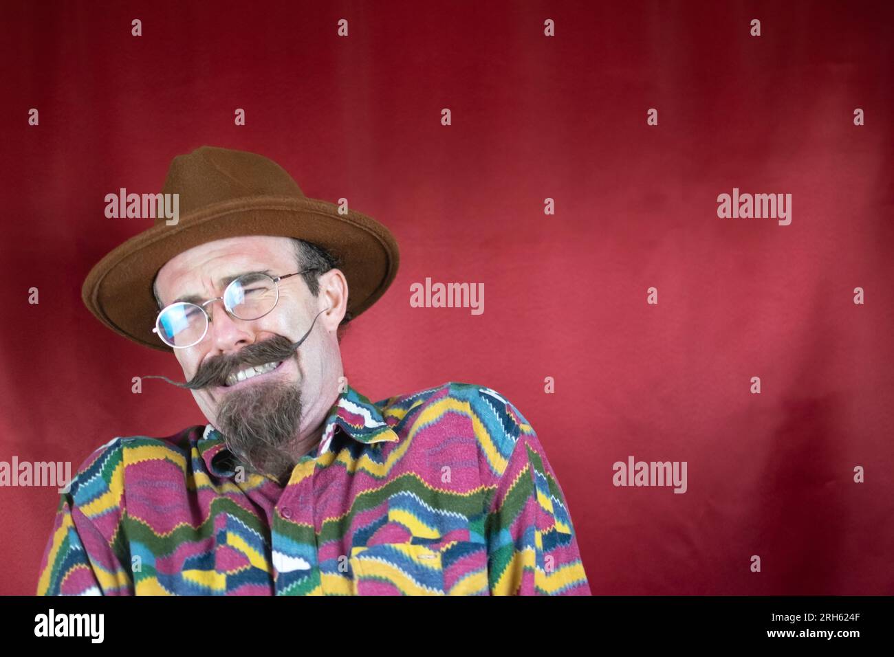 Vintage Hipster man with mustache, hat, glasses and expression of pain ...