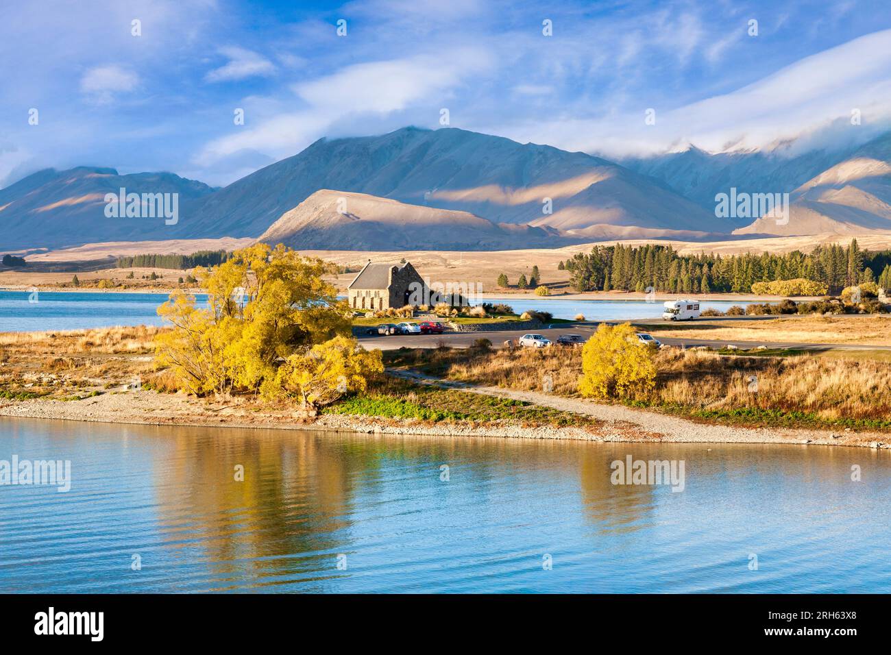 Church of the Good Shepherd on the shores of Lake Tekapo, Canterbury, New Zealand. Motorhome approaching the car park. This little church is on the... Stock Photo