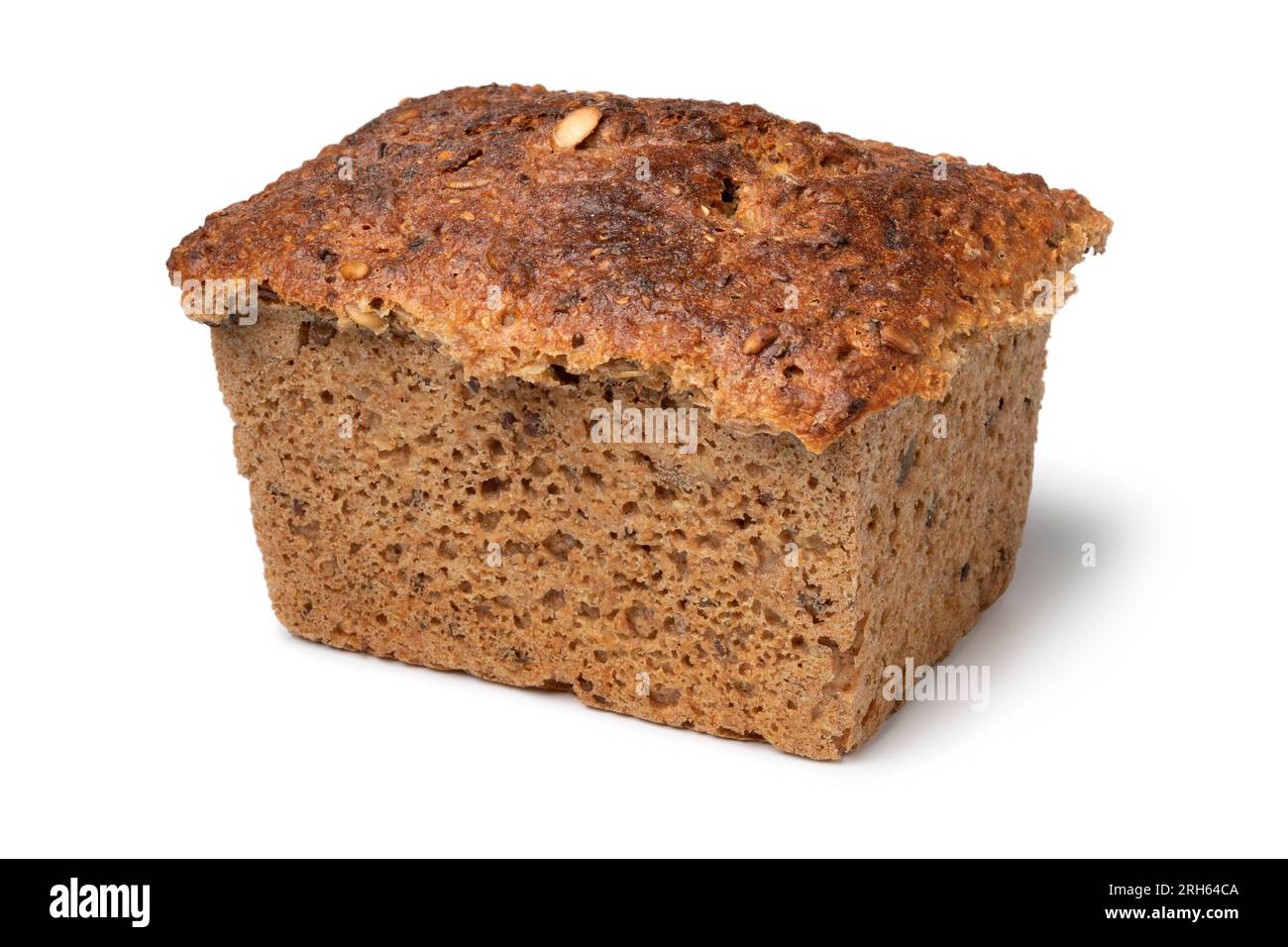 Single fresh Scandinavian loaf of sourdough spelt bread with a variation of seed close up isolated on white background Stock Photo