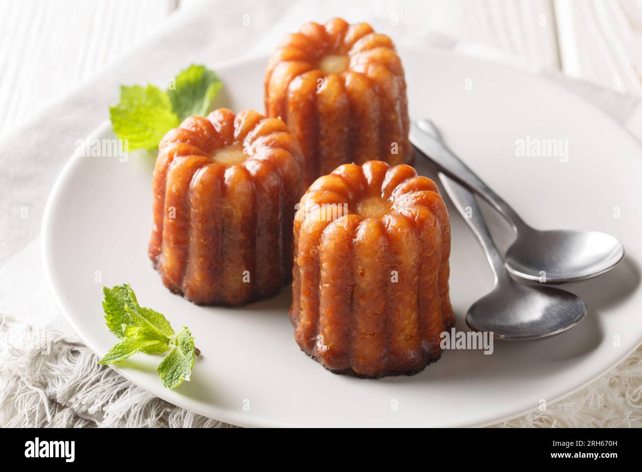 French Canele is a delicious pastry with a vanilla custard filling and ...