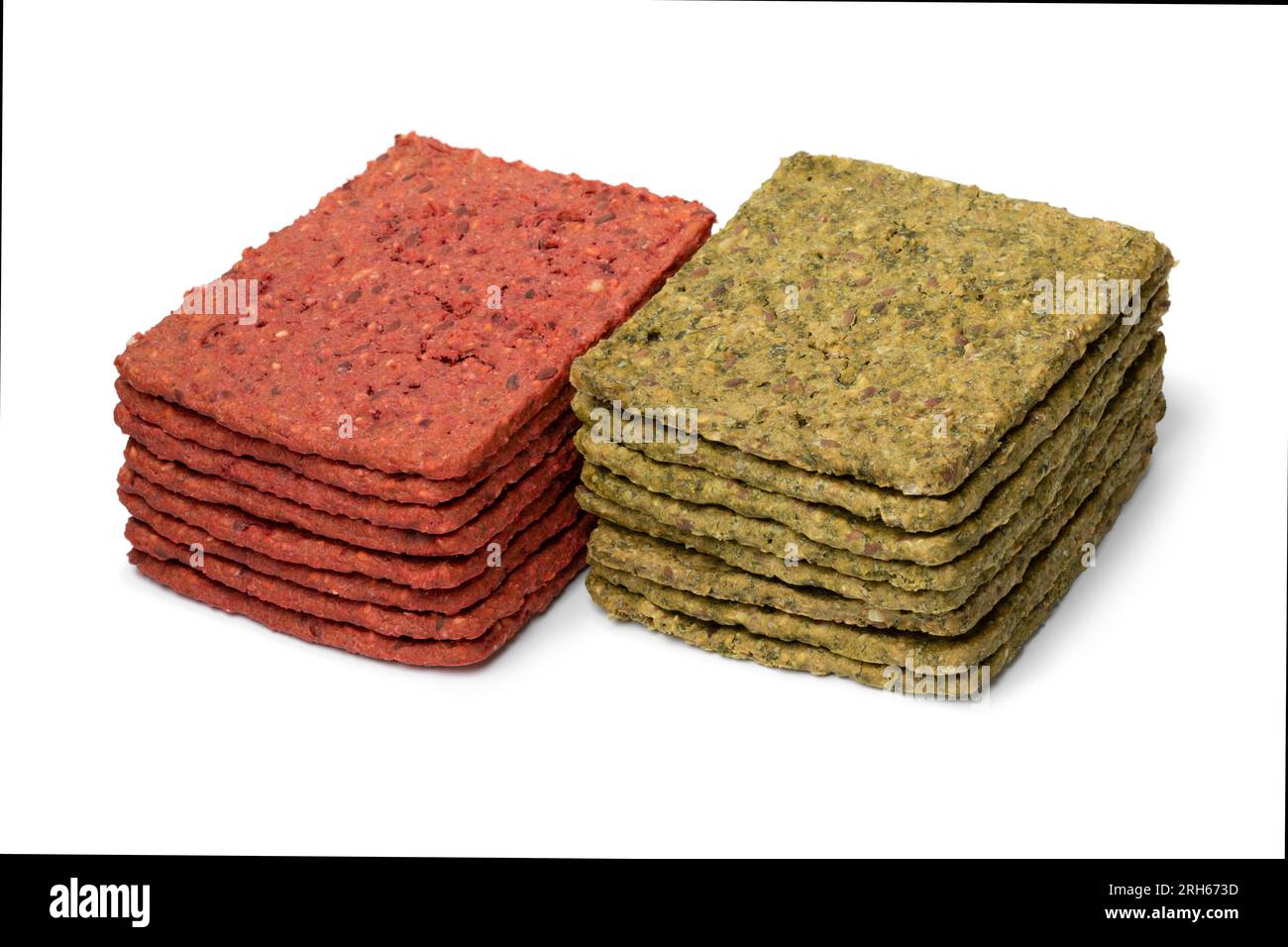 Heap of vegetable crackers seasoned with spinach and beet isolated on ...