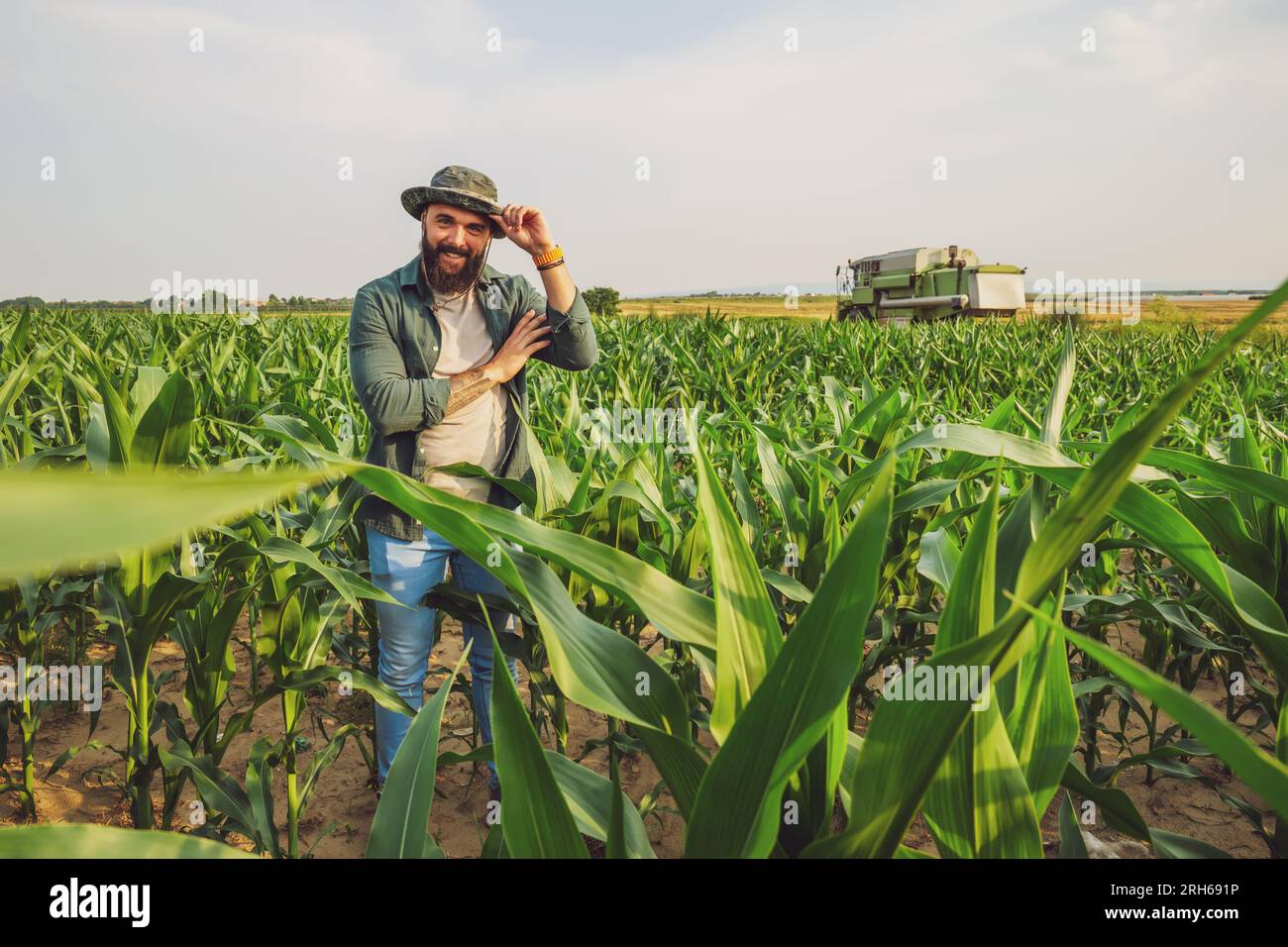 Portrait of farmer who is cultivating corn. Agricultural occupation. Stock Photo