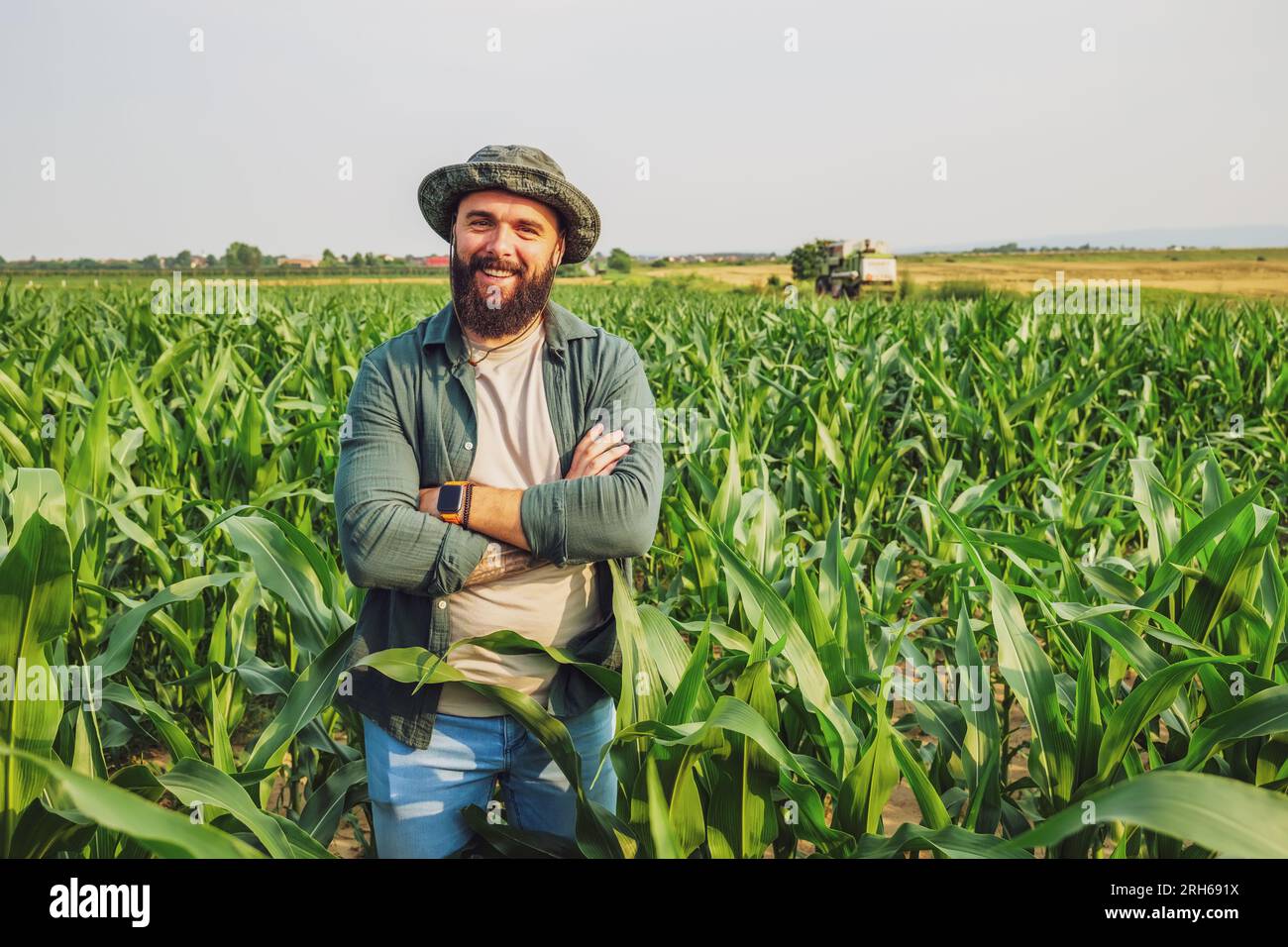 Portrait of farmer who is cultivating corn. Agricultural occupation. Stock Photo