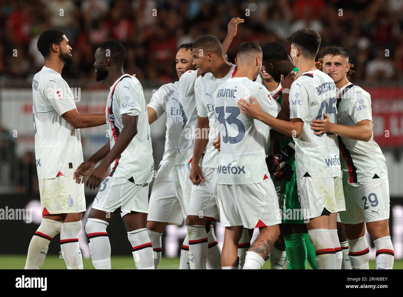Monza, Italy. 8th Aug, 2023. Team mates congratulate with Mike Maignan of AC Milan following the penalty shoot out victory in the Trofeo Silvio Berlusconi match at U-Power Stadium, Monza. Picture credit should read: Jonathan Moscrop/Sportimage Credit: Sportimage Ltd/Alamy Live News Stock Photo
