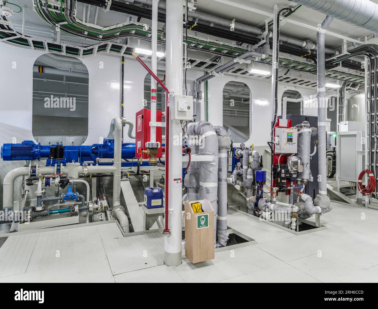 incredible photo of the engine room of a ship/submarine/cargo ship. showing engines and colorful pipelines. Stock Photo