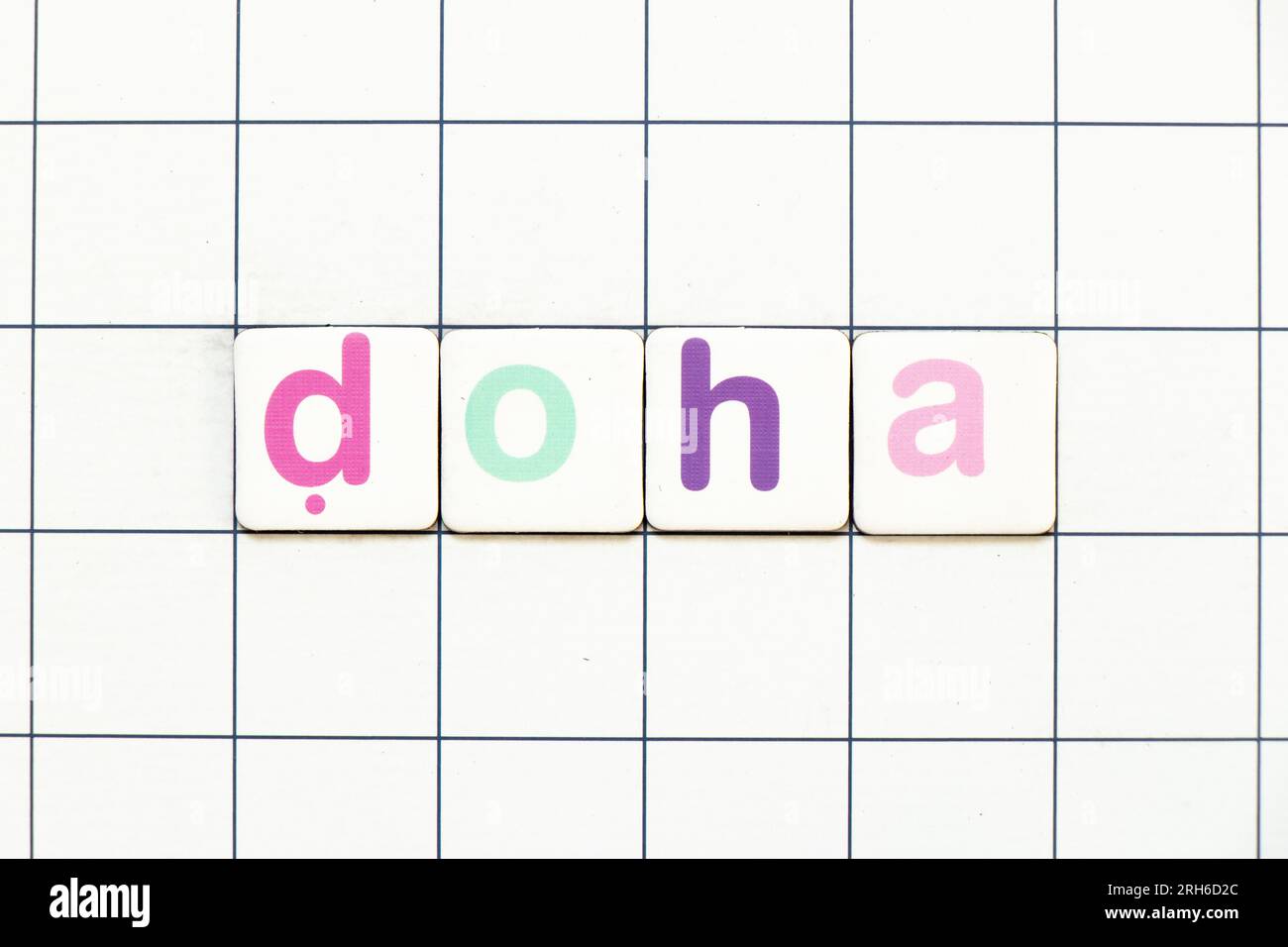 Colorful tile letter in word doha on white grid background Stock Photo ...