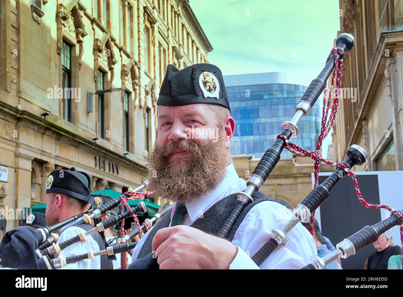 Glasgow, Scotland, UK. 14th  August, 2023.   Piping live hit the city as hundreds of pipe bad musicians swarmed the city centre with the Auckland pipe band from new zealand performing to crowds on buchanan street on the citys style mile.  Credit Gerard Ferry/Alamy Live News Stock Photo